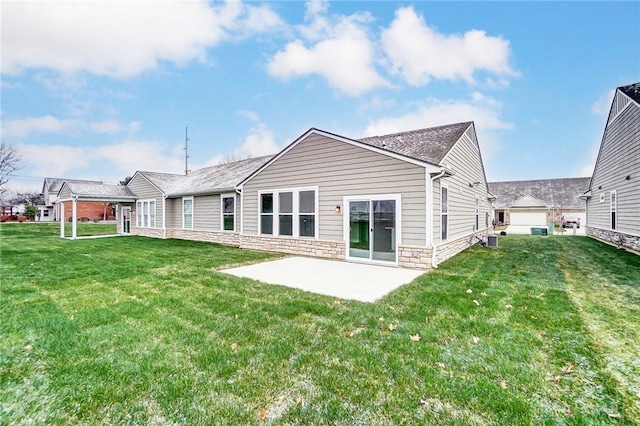 back of property featuring a yard, a patio, and central AC unit