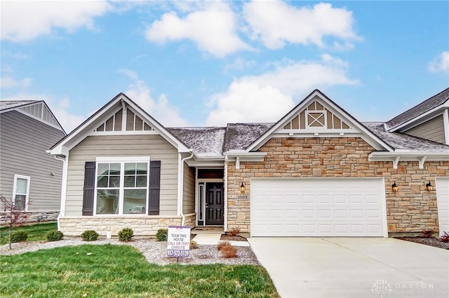 craftsman-style home with a garage