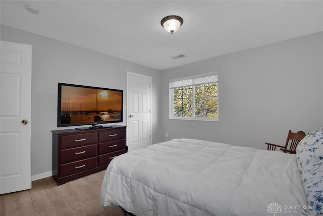 bedroom with light hardwood / wood-style floors