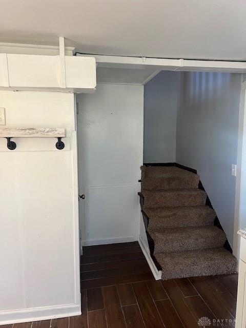 stairway with wood finished floors