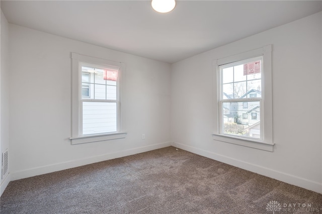 unfurnished room featuring carpet floors