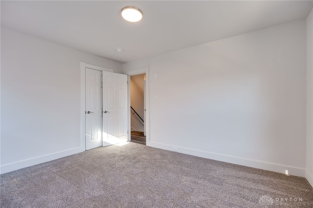 empty room featuring carpet flooring