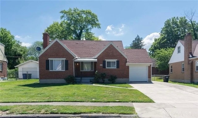 view of front of property featuring a garage and a front yard