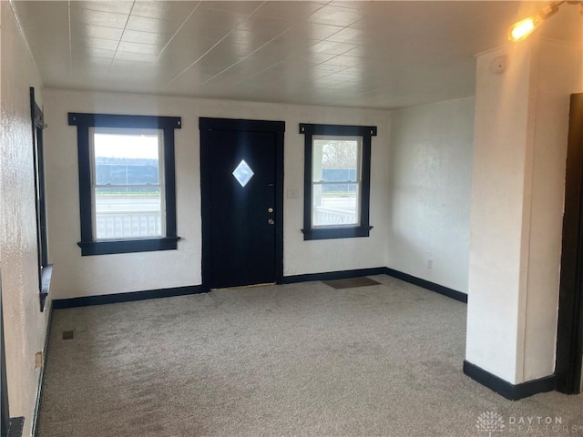 view of carpeted entrance foyer