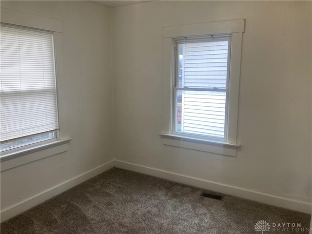 empty room featuring carpet flooring