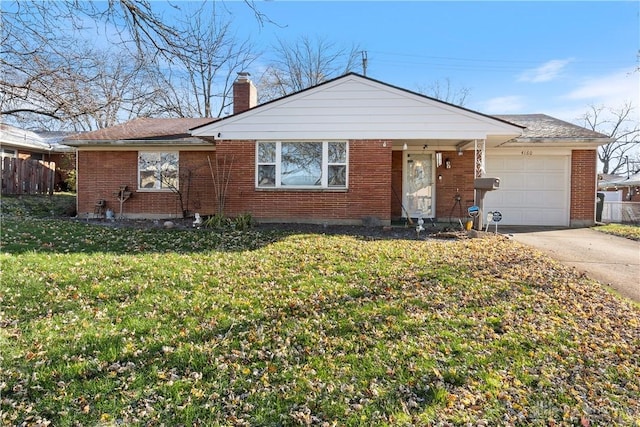 single story home with a garage and a front lawn