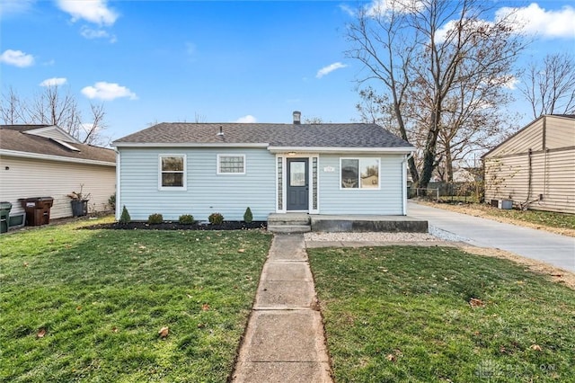 view of front of home with a front lawn