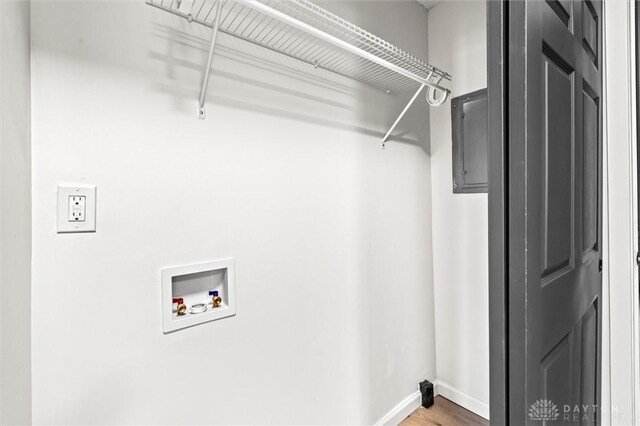 laundry area featuring hookup for a washing machine and hardwood / wood-style floors