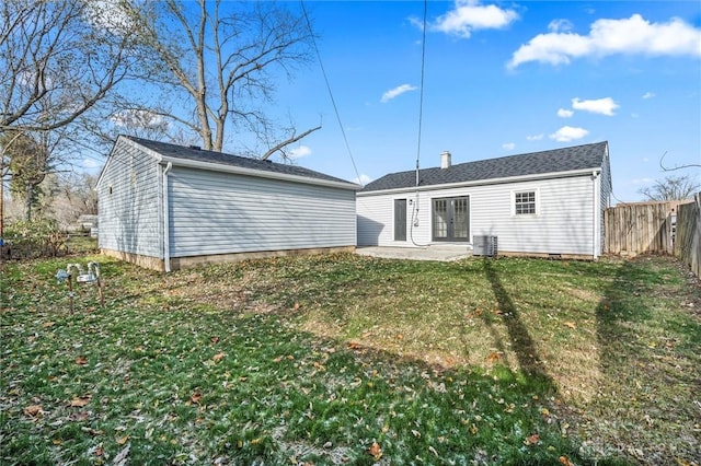 back of house featuring a yard, a patio, and central AC unit