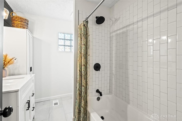 full bathroom featuring visible vents, shower / bathtub combination with curtain, vanity, a textured ceiling, and baseboards