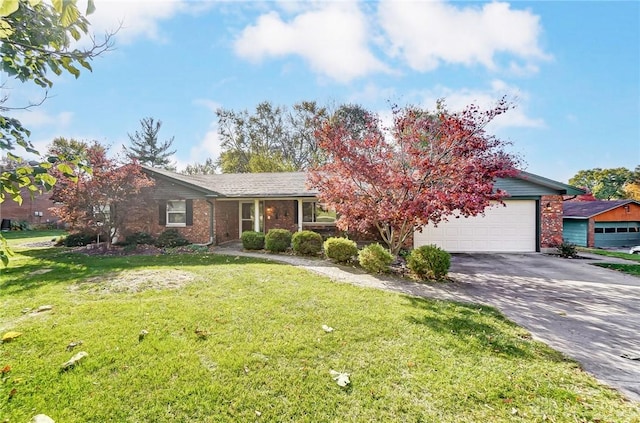 view of front of property with a garage and a front lawn