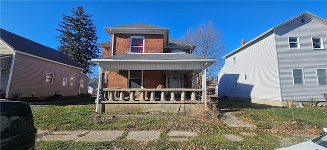 front of property featuring covered porch