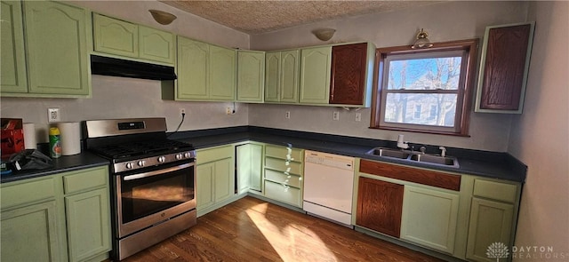 kitchen with stainless steel gas stove, dark hardwood / wood-style floors, white dishwasher, a textured ceiling, and green cabinetry