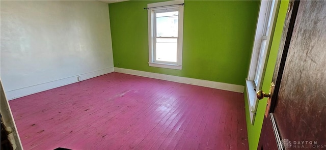 empty room with hardwood / wood-style floors