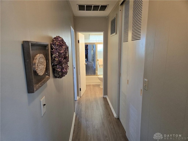 hall with dark hardwood / wood-style floors