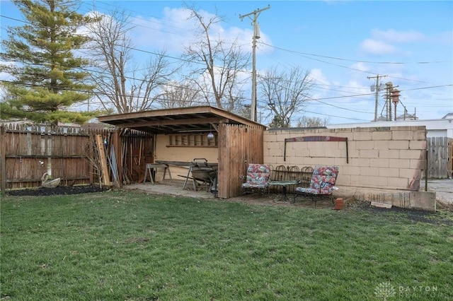 view of outbuilding featuring a yard