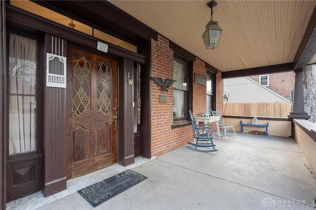 property entrance with covered porch