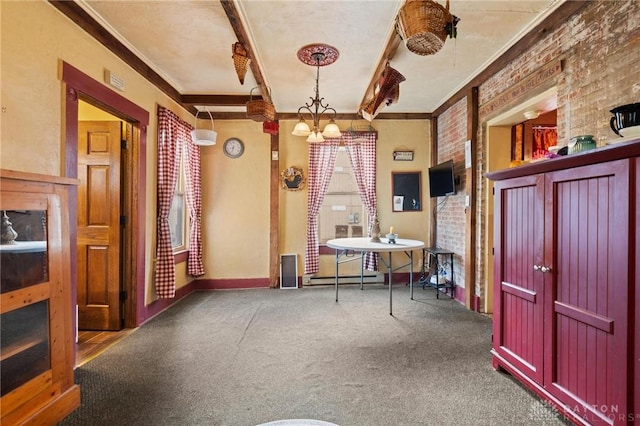 interior space featuring crown molding, beamed ceiling, brick wall, carpet, and a baseboard heating unit