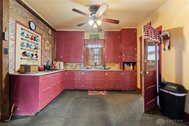 kitchen with crown molding and ceiling fan