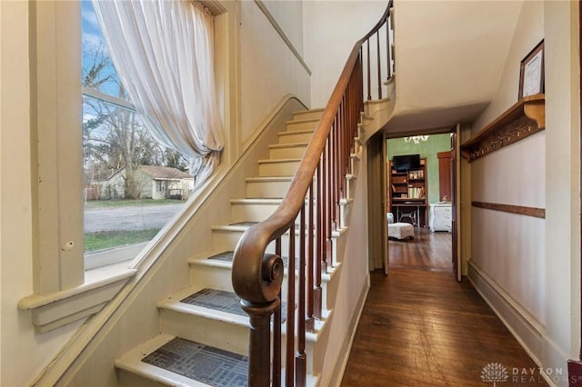 stairs with hardwood / wood-style floors