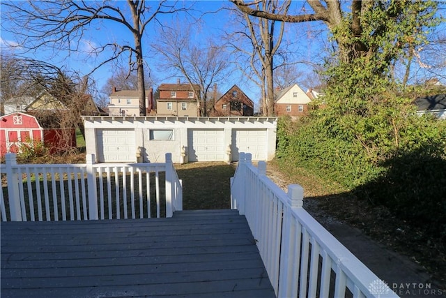 wooden deck with an outbuilding