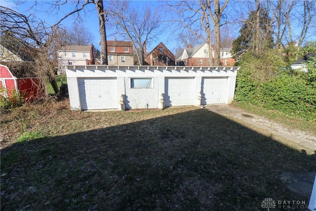 view of yard with a garage and an outdoor structure