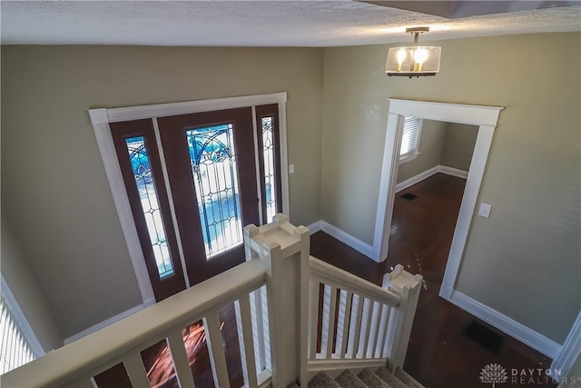 entryway featuring lofted ceiling