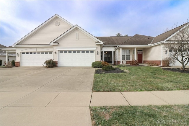 ranch-style home featuring a garage and a front lawn