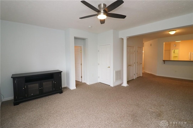 empty room featuring carpet floors and ceiling fan