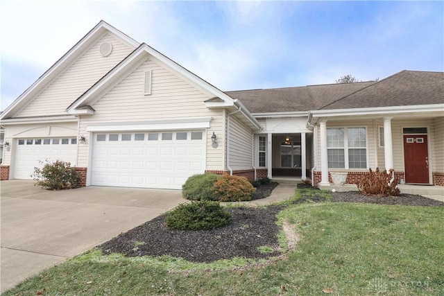 ranch-style home featuring a garage, concrete driveway, brick siding, and a shingled roof