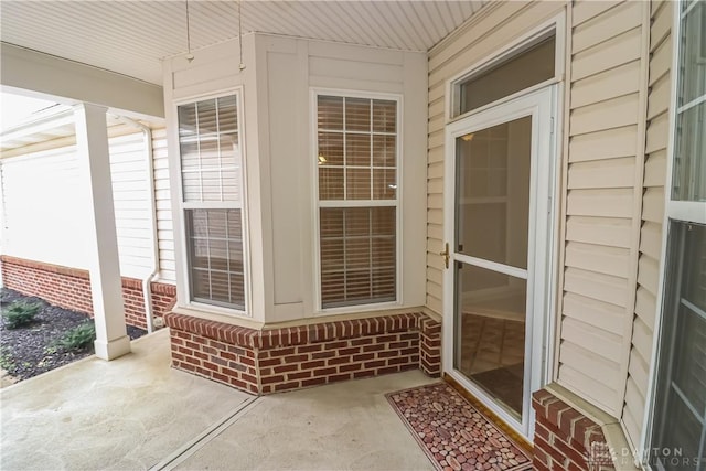 property entrance featuring a patio