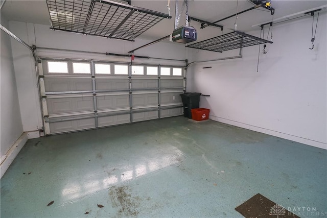 garage featuring baseboards and a garage door opener