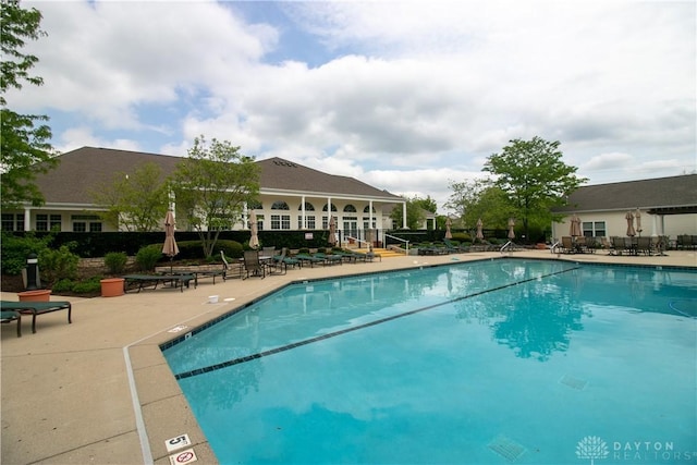 view of swimming pool featuring a patio area