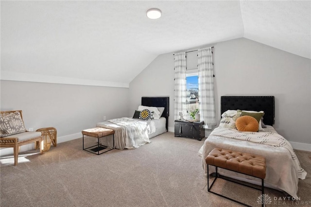 carpeted bedroom featuring lofted ceiling