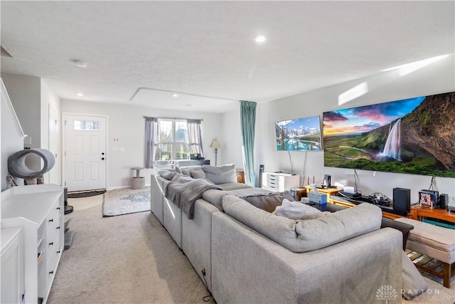 carpeted living room featuring a textured ceiling