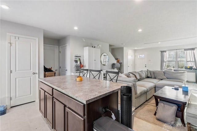 kitchen featuring dark brown cabinets and a center island