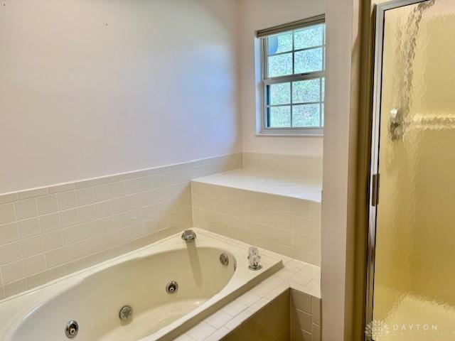 bathroom with plus walk in shower