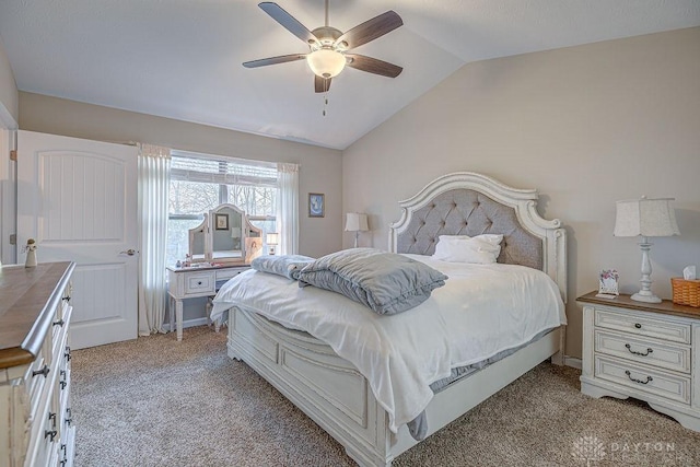 bedroom with vaulted ceiling, light carpet, and ceiling fan