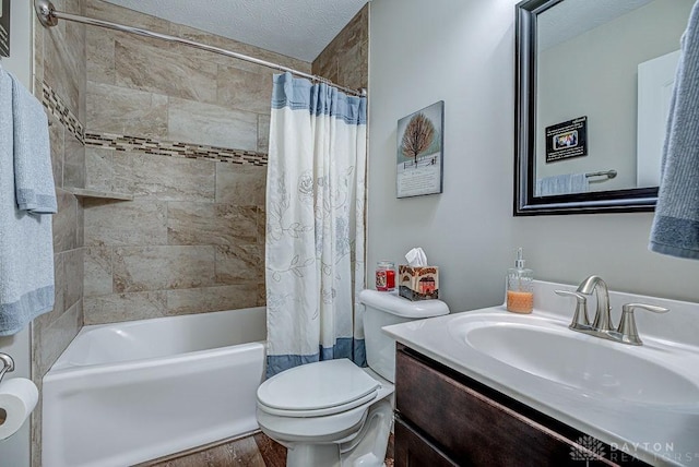 full bathroom with shower / bath combination with curtain, hardwood / wood-style flooring, vanity, toilet, and a textured ceiling