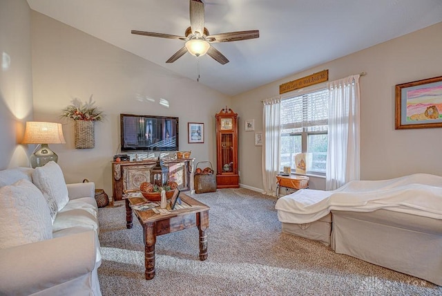 carpeted living room featuring ceiling fan and vaulted ceiling