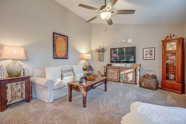 living room with ceiling fan, light colored carpet, and vaulted ceiling