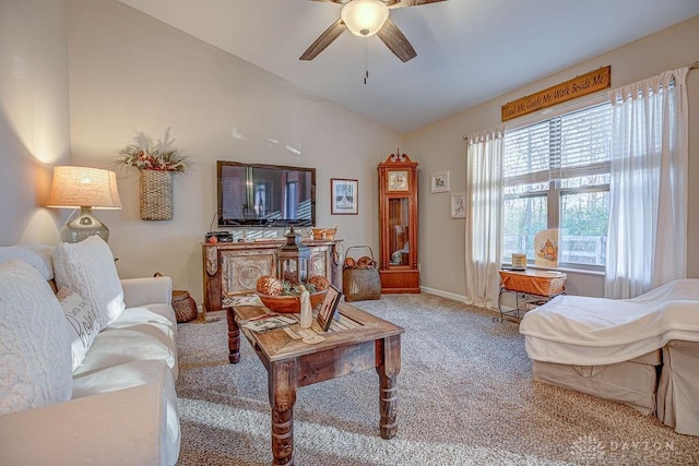 carpeted living room featuring lofted ceiling and ceiling fan