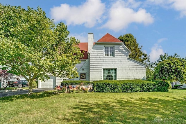 exterior space with a lawn and a garage