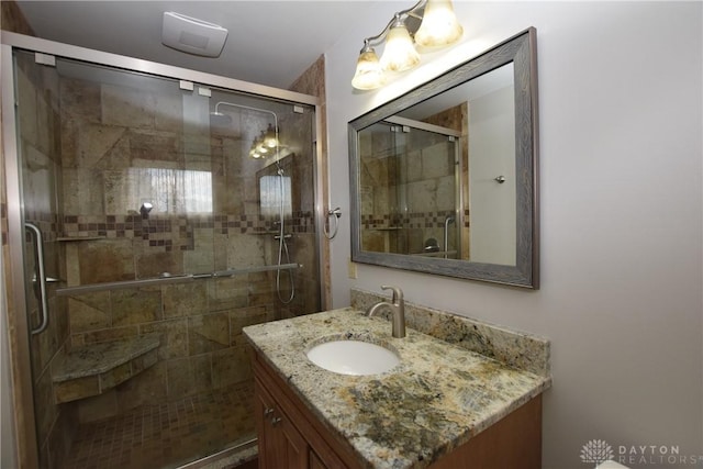 bathroom featuring vanity and walk in shower