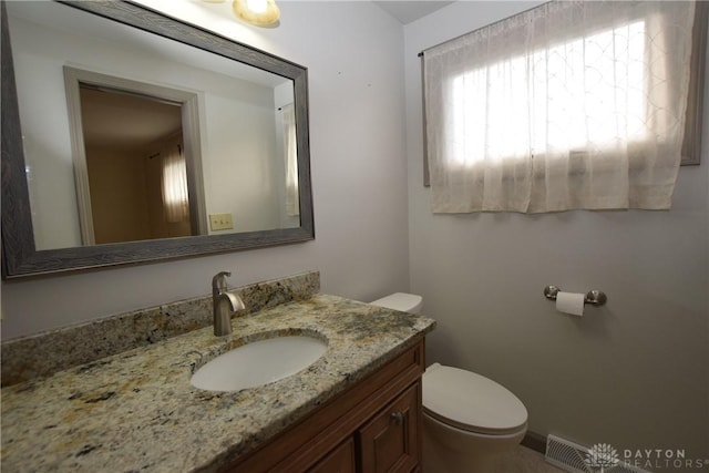 bathroom with vanity and toilet