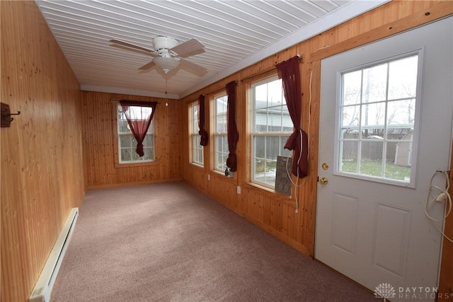 unfurnished sunroom with ceiling fan and a baseboard radiator