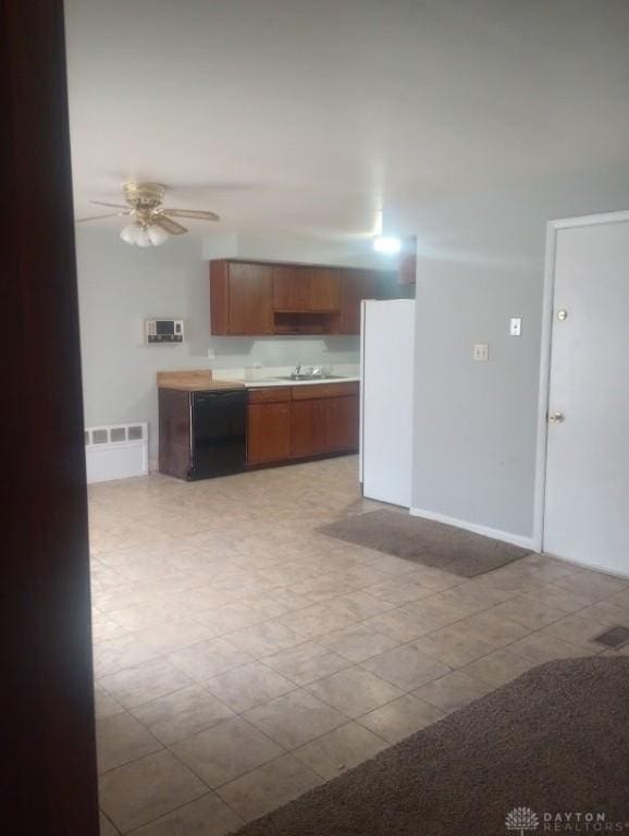 kitchen with ceiling fan, white refrigerator, dishwasher, and sink