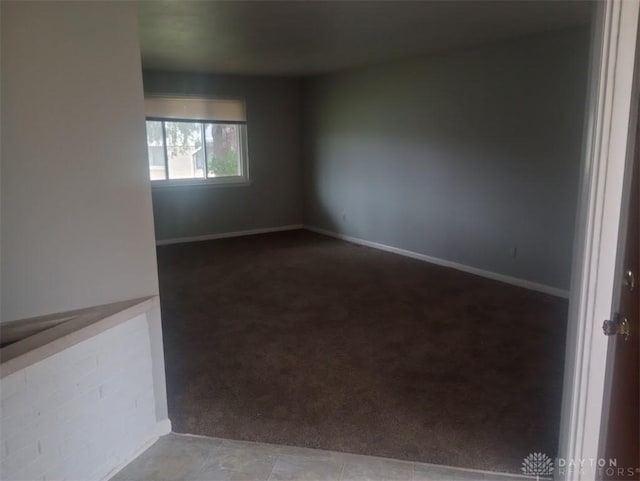 unfurnished room featuring carpet flooring