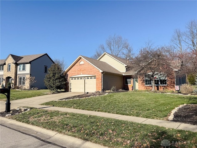 view of front of property featuring a front lawn and a garage