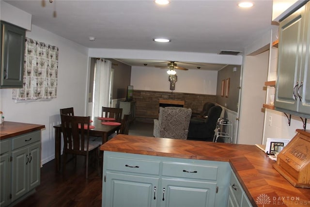 kitchen with visible vents, ceiling fan, butcher block counters, and open floor plan